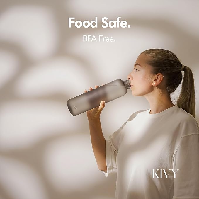 KIVY Slim Water Bottle 32oz [Lightweight & Shatterproof] Fits Backpack & Cupholder for Travel, Sports, School, Gym - Clear water bottle with measurements - Transparent Tritan Beige - Dishwasher Safe